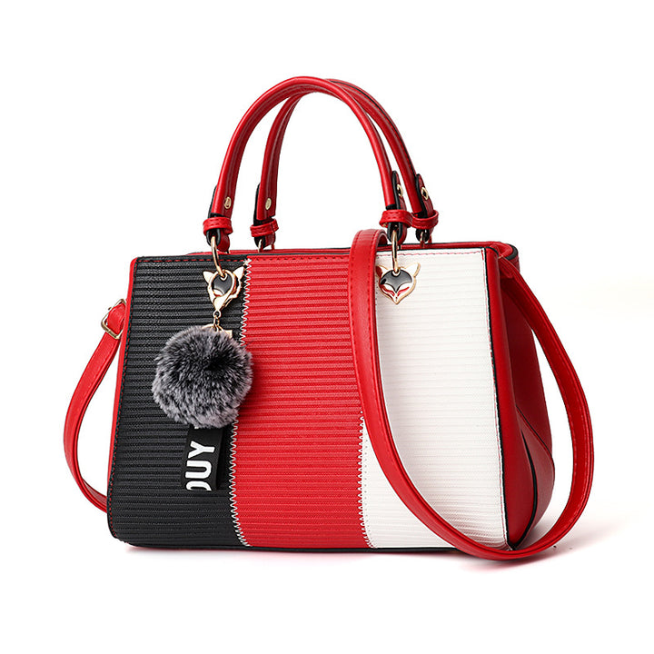Colour-block handbag with pompom charm