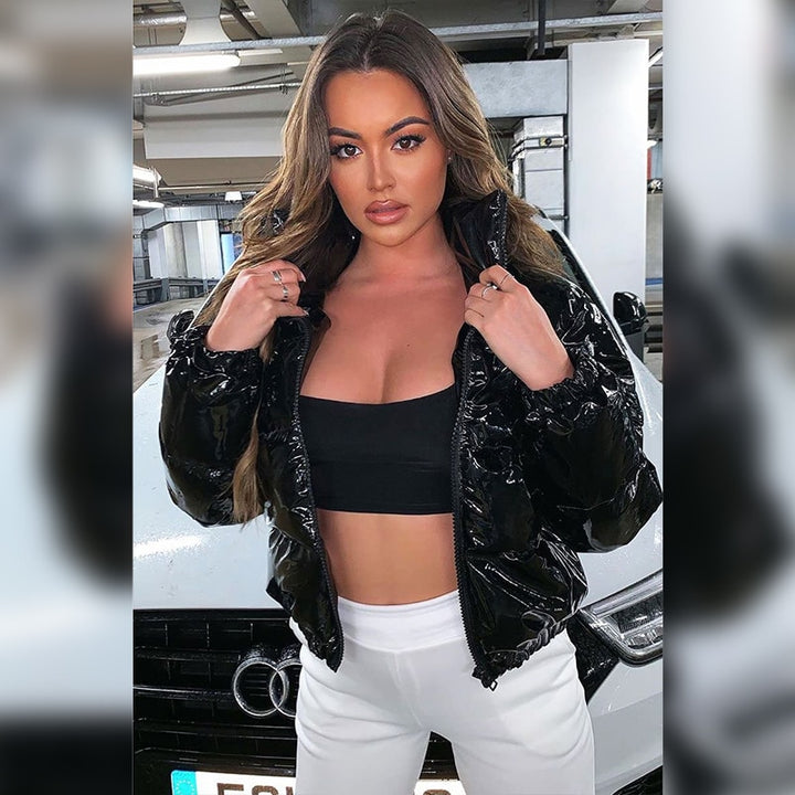 Woman in a glossy cropped puffer jacket