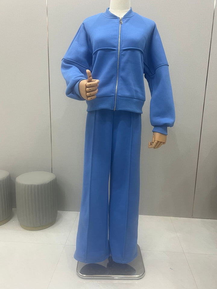 Woman in a zip jacket and wide-leg trousers set