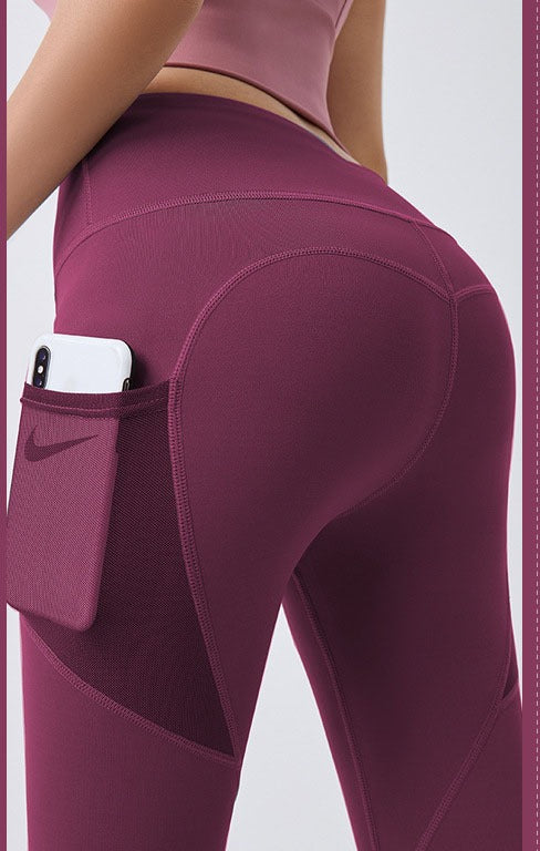 Woman wearing high-waist leggings with phone pocket