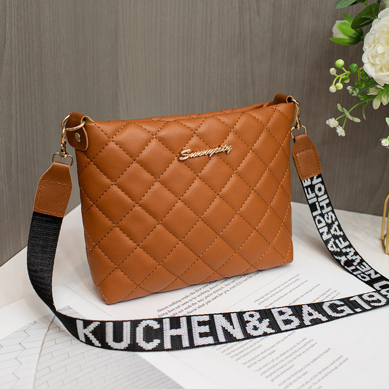 Small quilted crossbody bag with wide strap