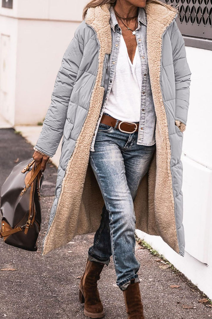 Long hooded coat with raglan sleeves and pockets, reversible